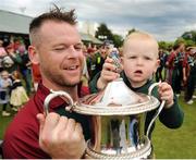 27 August 2016; Merrion CC captain Dom Joyce, hold the cup with son Alexander, age 19 months following his team's victory during the Irish Cricket Senior Cup Final against Waringstown CC at Castle Avenue in Clontarf, Co. Dublin. Photo by Seb Daly/Sportsfile
