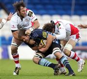 21 November 2010; Xavier Rush, Cardiff Blues, is tackled by Pedrie Wannennurg and Robbie Diack, right, Ulster. Celtic League, Cardiff Blues v Ulster, Cardiff City Stadium, Cardiff, Wales. Picture credit: Steve Pope / SPORTSFILE