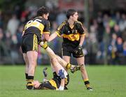 21 November 2010; Colm Cooper, Dr. Crokes, receives treatment for cramp from team-mates Ambrose O'Donovan and Niall O'Connell during extra time against Aherlow. AIB GAA Football Munster Club Senior Championship Semi-Final, Aherlow v Dr. Crokes, Cashel GAA Grounds, Cashel, Co. Tipperary. Picture credit: Matt Browne / SPORTSFILE