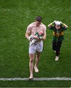28 August 2016; Marc Ó Sé of Kerry leaves the field holding his son Tadhg after the GAA Football All-Ireland Senior Championship Semi-Final game between Dublin and Kerry at Croke Park in Dublin. Photo by Daire Brennan/Sportsfile
