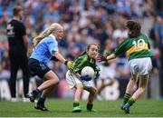28 August 2016; Cara King, Holy Family National School, Tubbercurry, Sligo, representing Kerry, in action against Ava Cornally, Tubber NS, Moate, Westmeath, representing Dublin, during the INTO Cumann na mBunscol GAA Respect Exhibition Go Games at the GAA Football All-Ireland Senior Championship Semi-Final game between Dublin and Kerry at Croke Park in Dublin. Photo by Stephen McCarthy/Sportsfile