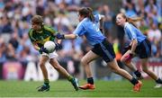28 August 2016; Aoife Mulkern, Lisnagry, NS, Lisnagry, Limerick, representing Kerry, in action against Sinéad O'Connor, Knockanean NS, Ennis, Clare, representing Dublin, during the INTO Cumann na mBunscol GAA Respect Exhibition Go Games at the GAA Football All-Ireland Senior Championship Semi-Final game between Dublin and Kerry at Croke Park in Dublin. Photo by Stephen McCarthy/Sportsfile