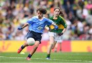 28 August 2016; Jayne Merren, St Laurence's NS, Kindlestown, Wicklow, representing Dublin, in action against Róisín Montgomery, Mullagh NS, Mullagh, Ennis, Clare, representing Kerry,  during the INTO Cumann na mBunscol GAA Respect Exhibition Go Games at the GAA Football All-Ireland Senior Championship Semi-Final game between Dublin and Kerry at Croke Park in Dublin. Photo by Stephen McCarthy/Sportsfile