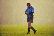 22 November 2010; Referee Brendan McGovern checks his watch as the rain becomes heavier at the end of the game. Duff Cup Semi-Final, CBS Naas v East Glendalough, Old Wesley RFC, Kiltiernan, Co. Dublin. Picture credit: Barry Cregg / SPORTSFILE