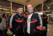 24 November 2010; Down footballers Martin Clarke, left, and Benny Coulter, queue to check in prior to departure for Kuala Lumpur ahead of the 2010 GAA Football All-Stars Tour, sponsored by Vodafone. Dublin Airport, Dublin. Picture credit: Brian Lawless / SPORTSFILE