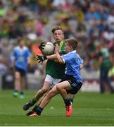 28 August 2016; Darragh O'Connell, Ovens NS, Ovens, Cork, representing Kerry, in action against Luke Whitney, St Oliver Plunkett BNS, Moate, Westmeath, representing Dublin, during the INTO Cumann na mBunscol GAA Respect Exhibition Go Games at the GAA Football All-Ireland Senior Championship Semi-Final game between Dublin and Kerry at Croke Park in Dublin. Photo by Ray McManus/Sportsfile