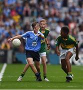 28 August 2016; Adam O'Neill, St Fiachra's Senior School, Beamount, Dublin, representing Dublin, in action against Jack Meagher, St Mary's, Ashbourne, Meath, left, and Ciarán Hodanu, Ferrybank BNS, Ferrybank, Waterford, representing Kerry, during the INTO Cumann na mBunscol GAA Respect Exhibition Go Games at the GAA Football All-Ireland Senior Championship Semi-Final game between Dublin and Kerry at Croke Park in Dublin. Photo by Ray McManus/Sportsfile