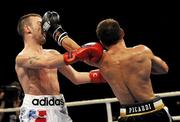 19 November 2010; Vincenzo Picardi, Thunder Milano, exchange punches with John Joe Nevin, Paris United, left, during their 54kg bout. World Series Boxing - Week 1, Palasharp, Milan, Italy. Picture credit; SPORTSFILE