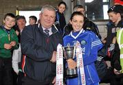 21 November 2010; Michelle Downes, West Clare Gaels, Clare, is presented with the trophy by Martin Allen, General Manager, Tesco Nenagh. Tesco All-Ireland Intermediate Ladies Football Club Championship Final, West Clare Gaels, Clare v St Conleth's, Laois, McDonagh Park, Nenagh, Co. Tipperary. Picture credit: Diarmuid Greene / SPORTSFILE