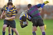 26 November 2010; Sean O'Driscoll, Skerries CC, is tackled by Josh Cowen, Sandford Park School. McMullen Cup Semi-Final, Skerries CC v Sandford Park School, ALSAA, Santry, Dublin. Picture credit: David Maher / SPORTSFILE