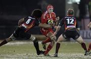 26 November 2010; Niall Ronan, Munster, is tackled by Toby Faletau, left, and Ashley Smith, Dragons. Celtic League, Dragons v Munster, Rodney Parade, Newport, Wales. Picture credit: Steve Pope / SPORTSFILE