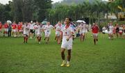 27 November 2010; The 2009 All-Stars rush to celebrate with Quynh Nguyen Ngoc a guest player from Vietnam, after he had kicked the final penalty of the game. GAA Football All-Stars Tour 2009, sponsored by Vodafone, 2009 All-Stars (white) v 2010 All-Stars (red), Royal Selangor Club, Bukit Kiara, Kuala Lumpur, Malaysia. Picture credit: Ray McManus / SPORTSFILE