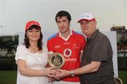 27 November 2010; Man of the Match Cathal Cregg from Roscommon and who lined out with the 2010 All-Stars, is presented with his award by Eileen Maher, Vodafone Ireland Fixed Services Director, and Uachtarán Chumann Lúthchleas Gael Criostóir Ó Cuana after the game. GAA Football All-Stars Tour 2009, sponsored by Vodafone, 2009 All-Stars v 2010 All-Stars, Royal Selangor Club, Bukit Kiara, Kuala Lumpur, Malaysia. Picture credit: Ray McManus / SPORTSFILE