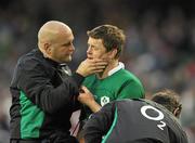 28 November 2010; Brian O'Driscoll, Ireland, receives medical attention from team doctor Dr. Eanna Falvey before being substituted. Autumn International, Ireland v Argentina, Aviva Stadium, Lansdowne Road, Dublin. Picture credit: David Maher / SPORTSFILE