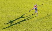 28 November 2010; A long shadow is cast by the low winter sun as Pa Bourke, Thurles Sarsfields, shoots for a point despite the best efforts of Dean Twomey, De La Salle. AIB GAA Hurling Munster Club Senior Championship Final, De La Salle v Thurles Sarsfields, Pairc Uí Chaoimh, Cork. Picture credit: Brendan Moran / SPORTSFILE