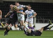 28 November 2010; Fergus McFadden, Leinster, is tackled by Ian Gough and Richard Fussell, right, Ospreys. Celtic League, Ospreys v Leinster, Liberty Stadium, Swansea, Wales. Picture credit: Steve Pope / SPORTSFILE