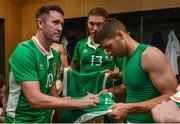 31 August 2016; Robbie Keane of Republic of Ireland signs jerseys for Wes Hoolahan, right, and Jeff Hendrick in the dressing room following the Three International Friendly game between the Republic of Ireland and Oman at the Aviva Stadium in Lansdowne Road, Dublin. Photo by David Maher/Sportsfile