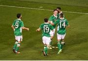 31 August 2016; Robbie Keane of Republic of Ireland, celebrates with team-mates, left to right, Shane Long, Robbie Brady, Cyrus Christie, and Jon Walters, after scoring his side's second goal during the Three International Friendly game between the Republic of Ireland and Oman at the Aviva Stadium in Lansdowne Road, Dublin. Photo by Daire Brennan/Sportsfile