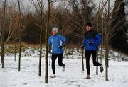 29 November 2010; Dundrum South Dublin athletes Joe Sweeney, from Booterstown, Dublin, right, winner of yesterday's Woodie's DIY AAI Inter County Cross Country Senior Men's race, and Alan McCormack, from Dundrum, Dublin, continue their training program despite the snowy conditions. UCD Campus, Belfield, Dublin. Picture credit: Stephen McCarthy / SPORTSFILE