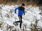 29 November 2010; Dundrum South Dublin athlete Joe Sweeney, from Booterstown, Dublin, winner of yesterday's Woodie's DIY AAI Inter County Cross Country Senior Men's race, continues his training program despite the snowy conditions. UCD Campus, Belfield, Dublin. Picture credit: Stephen McCarthy / SPORTSFILE