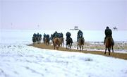 30 November 2010; A general view of horses and jockeys on the sand gallops, early in the morning, despite the freezing conditions at the Curragh Racecourse, Co. Kildare. Picture credit: Barry Cregg / SPORTSFILE