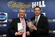 2 December 2010; &quot;The Club&quot; by Christy O'Connor has been announced as the 2010 William Hill Irish Sports Book of the Year. The Club is one of the finest books written on the subject of GAA and follows O'Connor's club, for whom he was goalkeeper, through a season in 2009 as they looked to revive past glories spurred on through personal losses and tragedy. This year’s shortlisted books included A Football Man by John Giles, Ruby by Ruby Walsh, Days of Heaven by Declan Lynch, My Story by Bernard Dunne, The Club by Christy O’Connor and Screaming at the Sky by Tony Griffin. Christy O'Connor is presented with his award by John Beresford, Head of William Hill Ireland, at the announcement. William Hill Bookmakers, Dame Street, Dublin. Picture credit: Brian Lawless / SPORTSFILE