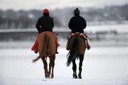 3 December 2010; A general view of two jockeys making their way to the sand Gallop, despite the freezing conditions, at the Curragh Racecourse, Co. Kildare. Picture credit: Barry Cregg / SPORTSFILE
