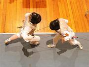 4 December 2010; Jenny Jennings, Dublin University Fencing Club, left, competes against Viviane Brefort, Dublin University Fencing Club, in the Women's Foil event during Day 1 of the Irish Open Fencing Championships. RDS Concert Hall, Ballsbridge, Dublin. Picture credit: Stephen McCarthy / SPORTSFILE