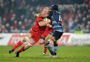 4 December 2010; Paul O'Connell, Munster, is tackled by Ma'ama Molitika, Cardiff Blues. Celtic League, Munster v Cardiff Blues, Thomond Park, Limerick. Picture credit: Brendan Moran / SPORTSFILE