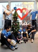 6 December 2010; Champion Sports was today unveiled as the Official Retail Partner to Leinster Rugby. The partnership that will also see Champion Sports stores operate as official ticketing agents for all Leinster Rugby games. Temple Street Children's Hospital will receive a donation from Champion Sports for every purchase of any Leinster product or tickets made in store. At today’s announcement in the new Grafton Street store were Leinster players, from left, Eoin O’Malley, Devin Toner and Eoin Reddan with Alice Brannigan, age 4, and Seren Evans, age 3, right. Champion Sports, Grafton Street, Dublin. Picture credit: Stephen McCarthy / SPORTSFILE