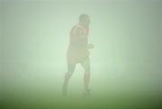 4 December 2010; Munster's Keith Earls is seen through thick fog late in the game. Celtic League, Munster v Cardiff Blues, Thomond Park, Limerick. Picture credit: Brendan Moran / SPORTSFILE