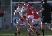 9 September 2001; Noel O'Leary of Cork tackles Philip Jordan of Tyrone during the All-Ireland Under 21 Football Championship Semi-Final match between Tyrone and Cork at Parnell Park in Dublin. Photo by David Maher/Sportsfile