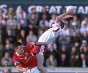9 September 2001; Peter Donnelly of Tyrone in action against Derek Kavanagh of Cork during the All-Ireland Under 21 Football Championship Semi-Final match between Tyrone and Cork at Parnell Park in Dublin. Photo by David Maher/Sportsfile
