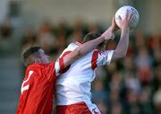 9 September 2001; Cormac McAnallen of Tyrone in action against Graham Canty of Cork during the All-Ireland Under 21 Football Championship Semi-Final match between Tyrone and Cork at Parnell Park in Dublin. Photo by David Maher/Sportsfile
