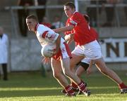 9 September 2001; Philip Jordan of Tyrone in action against Noel O'Leary of Cork during the All-Ireland Under 21 Football Championship Semi-Final match between Tyrone and Cork at Parnell Park in Dublin. Photo by David Maher/Sportsfile