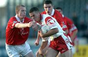 9 September 2001; Philip Jordan of Tyrone in action against Dillon Meeghan and Graham Canty of Cork during the All-Ireland Under 21 Football Championship Semi-Final match between Tyrone and Cork at Parnell Park in Dublin. Photo by David Maher/Sportsfile