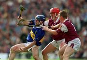 9 September 2001; Eoin Kelly of Tipperary is tackled by Ollie Canning, centre, and Gregory Kennedy of Galway during the Guinness All-Ireland Senior Hurling Championship Final match between Tipperary and Galway at Croke Park in Dublin. Photo by Ray McManus/Sportsfile