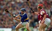 9 September 2001; Eoin Kelly of Tipperary in action against Ollie Canning, red helmet, and Gregory Kennedy of Galway during the Guinness All-Ireland Senior Hurling Championship Final match between Tipperary and Galway at Croke Park in Dublin. Photo by Ray McManus/Sportsfile
