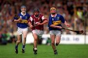 9 September 2001; Alan Kerins of Galway races clear of Eamonn Corcoran, right, and Lar Corbett of Tipperary during the Guinness All-Ireland Senior Hurling Championship Final match between Tipperary and Galway at Croke Park in Dublin. Photo by Brendan Moran/Sportsfile