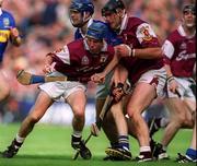 9 September 2001; Kevin Broderick of Galway, supported by team-mate Joe Rabbitte, is tackled by Paul Kelly of Tipperary during the Guinness All-Ireland Senior Hurling Championship Final match between Tipperary and Galway at Croke Park in Dublin. Photo by Brendan Moran/Sportsfile