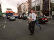 10 September 2001; Tipperary goalkeeper Brendan Cummins  crosses Westmoreland St in Dublin, with the Liam MacCarthy cup, after his side had been victorious in the All-Ireland Hurling Final where they defated Galway. Photo by Brendan Moran/Sportsfile