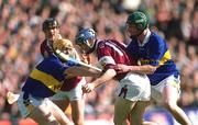 9 September 2001; Mark Kerins of Galway in action against David Kennedy, right, and Eamonn Corcoran of Tipperary during the Guinness All-Ireland Senior Hurling Championship Final match between Tipperary and Galway at Croke Park in Dublin. Photo by Aoife Rice/Sportsfile