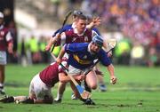 9 September 2001; Eugene O'Neill of Tipperary is tackled by Liam Hodgins, left, and Gregory Kennedy of Galway during the Guinness All-Ireland Senior Hurling Championship Final match between Tipperary and Galway at Croke Park in Dublin. Photo by Damien Eagers/Sportsfile