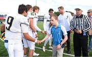 2 September 2016; Special Olympics Athlete Joe Whelan, age 13, from Dún Laoghaire, Co Dublin, shakes hands with Belen Jesuit players along with Jamie Heaslip after administering the coin toss ahead of the game between Marist School and Belen Jesuit. Donnybrook Stadium hosted a triple-header of high school American football games today as part of the Aer Lingus College Football Classic. Six top high school teams took part in the American Football Showcase with all proceeds from the game going to Special Olympics Ireland, the official charity partner to the Aer Lingus College Football Classic. High School American Football Showcase between Marist School of Atlanta, Georgia and Belen Jesuit of Miami, Florida at Donnybrook Stadium in Dublin. Photo by Cody Glenn/Sportsfile