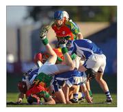 22 May 2010; The scrumhalf reaches into the ruck to take out the ball during the Leinster senior hurling clash between Carlow and Laois in Portlaoise. Picture credit: Stephen McCarthy / SPORTSFILE