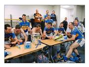 5 September 2010; Tribal rite. Tipperary players celebrate around the Liam MacCarthy Cup following its safe arrival back into their dressingroomn. Picture credit: Ray McManus / SPORTSFILE