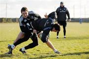 8 December 2010; Leinster's Darren Hudson, left, tackles team-mate Eoin O'Malley as forwards coach Jono Gibbs looks on during squad training ahead of their Heineken Cup, Pool 2, Round 3, game against ASM Clermont Auvergne on Sunday. Leinster Rugby squad training, Skerries RFC, Skerries, Co. Dublin. Picture credit: Barry Cregg / SPORTSFILE
