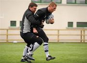 9 December 2010; Connacht's Rob Sweeney tackles team-mate Gavin Duffy during squad training ahead of their Amlin Challenge Cup, Pool 1, Round 3, game against Harlequins on Sunday. Connacht Rugby Squad Training, Sportsground, Galway. Picture credit: Barry Cregg / SPORTSFILE