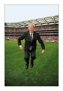 19 September 2010; Age shall not weary him, nor the years condemn. Micheál Ó Muircheartaigh gives a leap of joy on the pitch at Croke Park before commentating on his last All-Ireland senior championship final. Micheál’s radio career began with the Railway Cup finals of 1949 and his voice has been the theme of summer ever since. Picture credit: Ray McManus / SPORTSFILE    This image may be reproduced free of charge when used in conjunction with a review of the book &quot;A Season of Sundays 2010&quot;. All other usage © SPORTSFILE