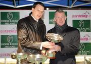 10 December 2010; Michael Kinane, right, Horse Racing Ireland, presenting the Champion Trainer cup to Aidan O'Brien. Horse racing, Dundalk Racecourse, Dundalk, Co. Louth. Photo by Sportsfile